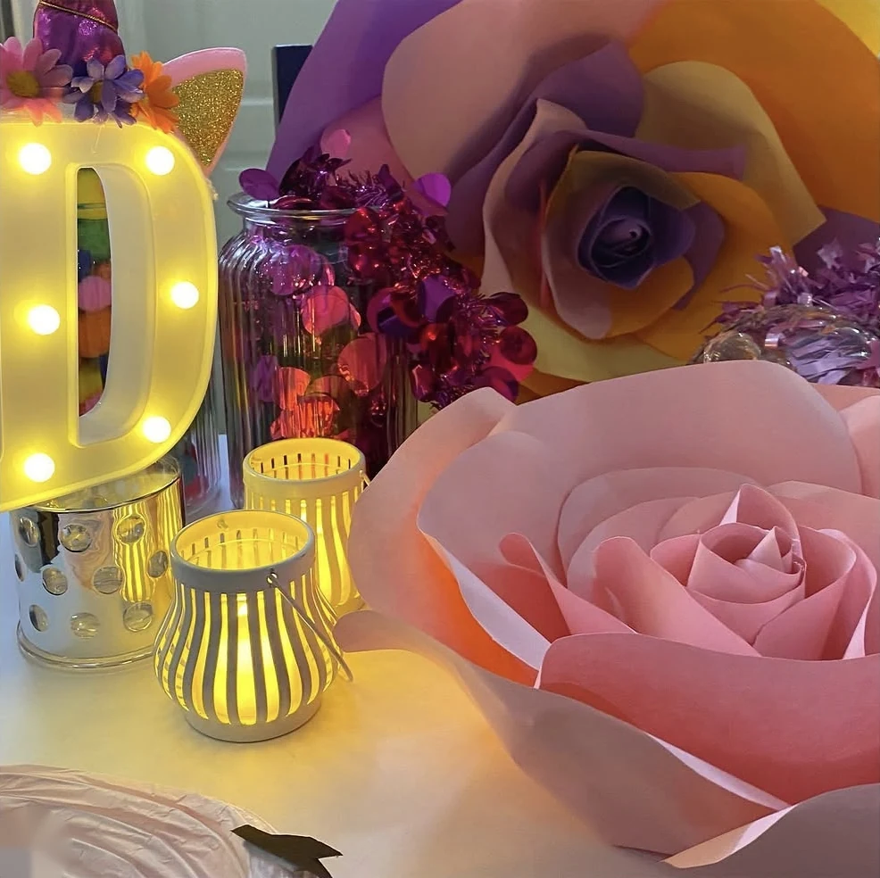 Marquee letter, lanterns, paper roses